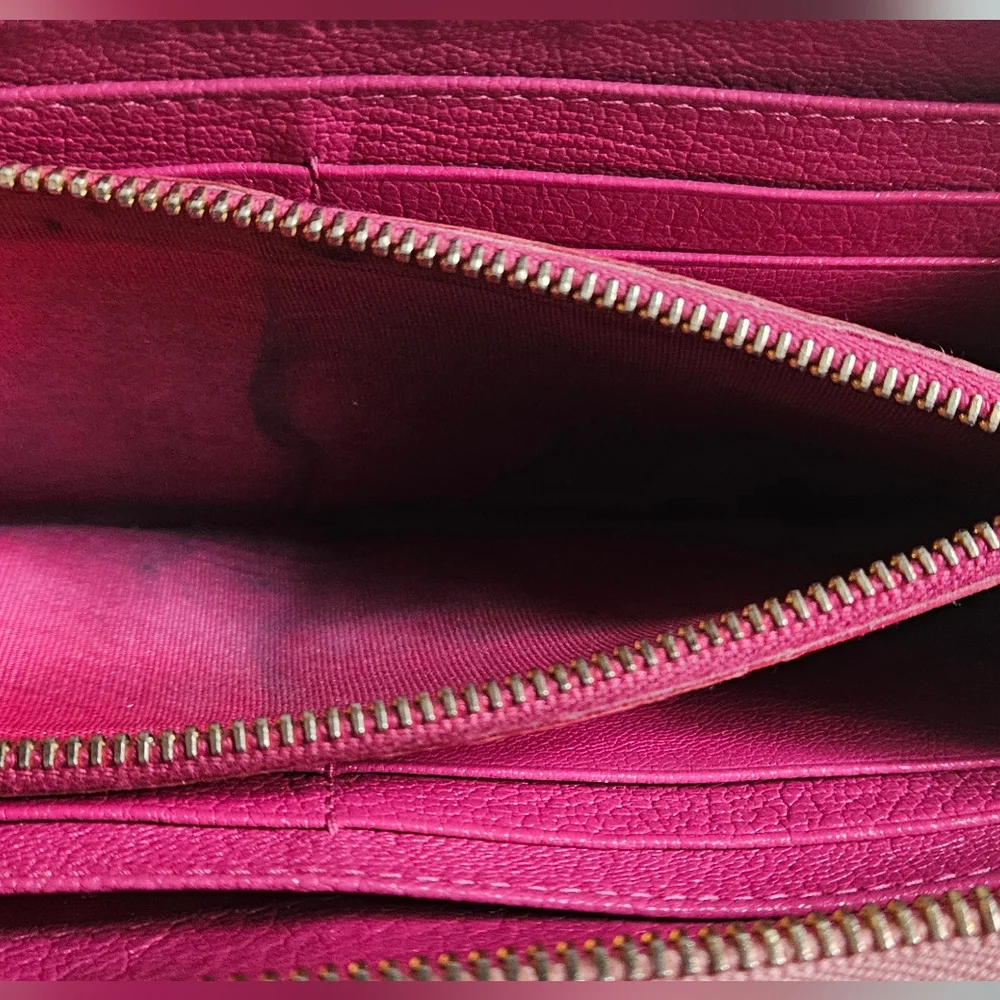 Miu Miu Pink Wallet with Elegant Zip Closure